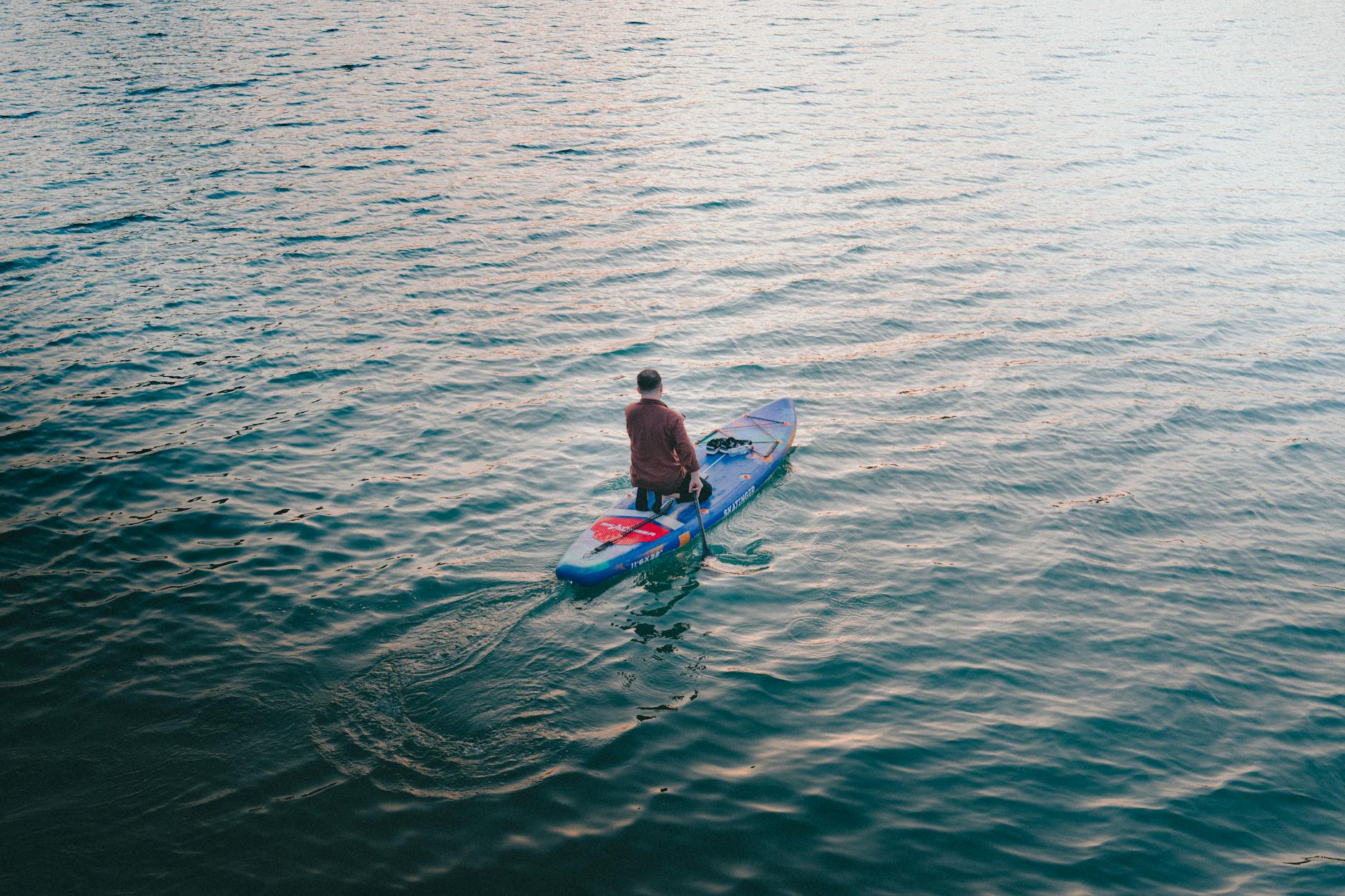 paddleboarding on a tranquil lake in adana