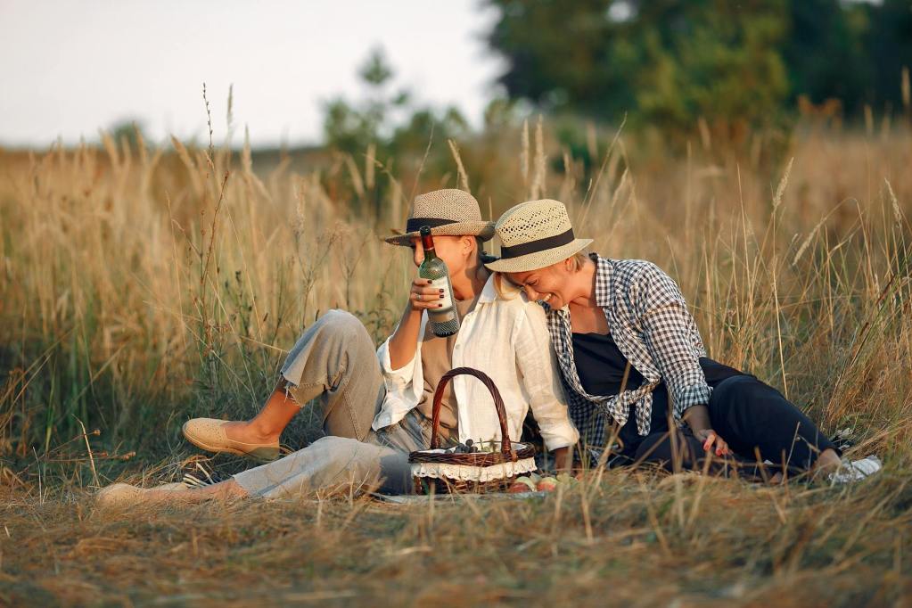 loving female couple enjoying romantic picnic